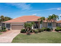 Single-Gathering home with tile roof and lush landscaping at 584 Toulouse Dr, Punta Gorda, FL 33950