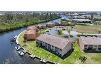 Waterfront community with boat docks and lush landscaping at 1354 Rock Dove Ct # A201, Punta Gorda, FL 33950