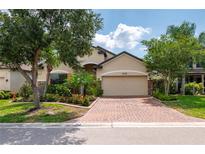 Attractive single-Gathering home with a brick driveway and lush landscaping at 4093 River Bank Way, Punta Gorda, FL 33980