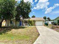 House exterior featuring a light-colored facade and a driveway at 2274 Lee Ter, Port Charlotte, FL 33952