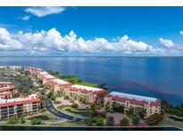 Aerial view of waterfront condo building at 85 Vivante Blvd # 8534, Punta Gorda, FL 33950