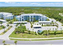 Luxury condo building with parking and waterfront views at 14121 Heritage Landing Blvd # 731, Punta Gorda, FL 33955