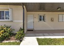 Condo building exterior with walkway and landscaping at dusk at 25275 Rampart Blvd # 2001, Punta Gorda, FL 33983