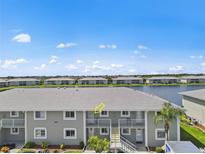 Aerial view of condo building near water at 3310 Loveland Blvd # 1907, Punta Gorda, FL 33980