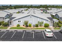 Aerial view of a community of villas with ample parking at 3300 Loveland Boulevard # 1904, Port Charlotte, FL 33980