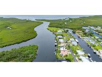 Aerial view of waterfront property with canal access at 5480 Sea Edge Dr, Punta Gorda, FL 33950