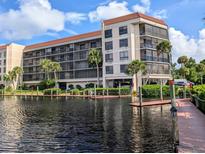 Canal front building with boat docks at 25188 Marion Ave # D101, Punta Gorda, FL 33950