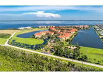 Aerial view of waterfront community with resort-style amenities at 97 Vivante Blvd # 9727/207, Punta Gorda, FL 33950