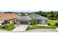 Single-story home with two-car garage and lake view at 1708 Palace Ct, Punta Gorda, FL 33980