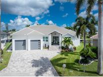 Luxury waterfront home with three-car garage at 1200 Gorda Cay Ln, Punta Gorda, FL 33950