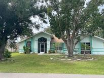 Charming single story home with a well-maintained lawn at 269 Rosemary St, Port Charlotte, FL 33954
