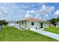 Single story home with attached garage and spacious yard at 512 Chamber Nw St, Port Charlotte, FL 33948