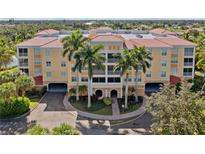 Two-story building with terracotta roofs and palm trees at 255 W End Dr # 2201, Punta Gorda, FL 33950