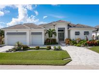 Two-story home with two car garage and landscaped yard at 2511 Rio Largo Ct, Punta Gorda, FL 33950