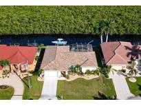 Canal front home with private dock and lush landscaping at 729 Macedonia Dr, Punta Gorda, FL 33950