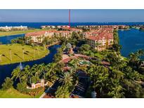 Aerial view of upscale condo community with water access and lush landscaping at 95 Vivante Blvd # 9542, Punta Gorda, FL 33950