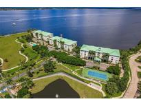 Stunning aerial view of waterfront community and tennis courts at 200 Harbor Walk Dr # 243, Punta Gorda, FL 33950