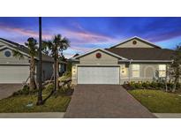 Charming house with brick driveway and landscaping at 1530 Laurel Brook Ln, Port Charlotte, FL 33953