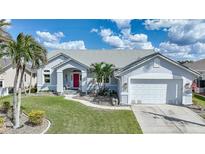 Single story home with white garage door at 3836 Saint Girons Dr, Punta Gorda, FL 33950