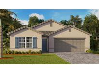 Exterior of a single-story house with a two-car garage and landscaping at 107 Santarem Cir, Punta Gorda, FL 33983