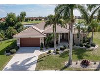 Single Gathering home with tile roof and palm trees at 4077 La Costa Island Ct, Punta Gorda, FL 33950