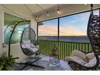 Peaceful balcony with sunset views and comfortable seating at 43050 Greenway Blvd # 645, Punta Gorda, FL 33982