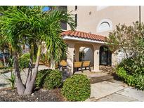 Building features a covered seating area with benches at 25188 Marion Ave # B304, Punta Gorda, FL 33950
