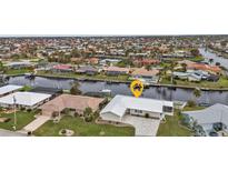 Aerial view of the property, highlighting its canal-front location at 950 Genoa Ct, Punta Gorda, FL 33950