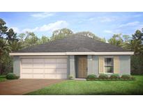 One-story home with a two-car garage and landscaped yard at 1572 Biscayne Dr, Port Charlotte, FL 33953