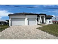 Newly built home with two-car garage and paved driveway at 17315 Cape Horn Blvd, Punta Gorda, FL 33955