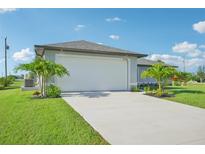 Newly built home with a two car garage and landscaping at 11505 3Rd Ave, Punta Gorda, FL 33955