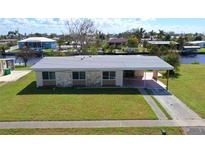 Single-Gathering home with canal access, large yard at 554 Lindley Ter, Port Charlotte, FL 33952