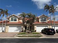 Two-story building with attached garages at 2620 Tarpon Cove Dr # 311, Punta Gorda, FL 33950