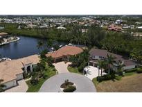 Birds-eye view of waterfront homes and lush landscaping at 3507 Terin Ct, Punta Gorda, FL 33950