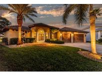 Beautiful one-story home with palm trees and landscaping at 4201 Eagle Nest Ct, Port Charlotte, FL 33948