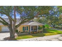 Quaint villa with screened porch and lush landscaping at 1162 Green Oak Trl, Port Charlotte, FL 33948