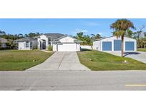 Single-Gathering home with attached garage and detached workshop at 17152 Wintergarden Ave, Port Charlotte, FL 33948