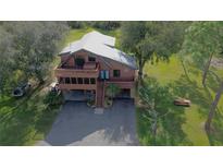 Two-story home with a large deck and screened porch at 3681 Hidden Valley Cir, Punta Gorda, FL 33982