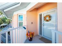 Condo front entry with wreath and balcony at 19310 Water Oak Dr # 203, Port Charlotte, FL 33948