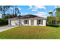 Newly built home with a two-car garage at 2748 Cranbrook Ave, North Port, FL 34286