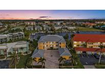 Aerial view of waterfront community, showing building and surrounding landscape at 3216 Purple Martin Dr # 122, Punta Gorda, FL 33950