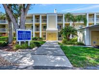 Building exterior with parking and landscaping at 433 Cerromar Ln # 441, Venice, FL 34293