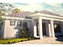 Single-story home with modern design, covered entry, and landscaped yard at 24089 N Peppercorn Rd, Punta Gorda, FL 33955