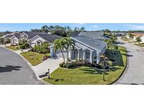 Attractive single-story home with landscaped yard and two-car garage in quiet community at 24415 Buckingham Way, Punta Gorda, FL 33980