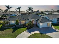 Luxury waterfront home with private dock and lush landscaping at 809 Lucia Dr, Punta Gorda, FL 33950