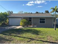Newly renovated home with a large yard and attached garage at 4525 Church St, Punta Gorda, FL 33980