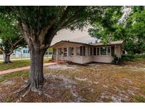 Charming single story home with mature landscaping and a spacious front yard at 515 W Olympia Ave, Punta Gorda, FL 33950