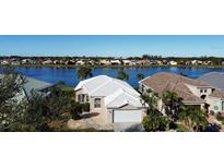 Aerial view of a house community with lakefront properties at 26159 Stillwater Cir, Punta Gorda, FL 33955