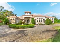 Elegant two-story home with circular driveway and fountain at 3409 Carpel St, Plant City, FL 33566