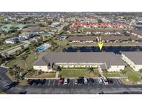Aerial view of waterfront condo community with pool and boat slips at 4000 Bal Harbor Blvd # 126, Punta Gorda, FL 33950